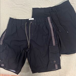 2 pairs swim trunks/board shorts. Loose fitting. Size M and size L.